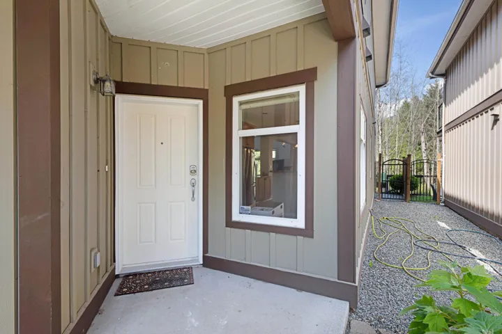 View of exterior entry with board and batten siding