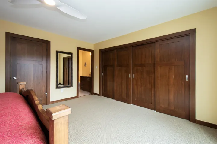 Recessed panel wood doors and trim with light-toned wall paint