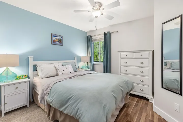 Bedroom with wood finished floors and a ceiling fan