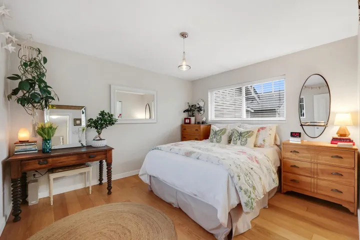 Bedroom featuring light wood-style floors and baseboards