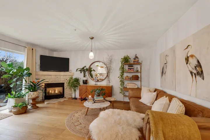 Living area featuring wood finished floors and a fireplace
