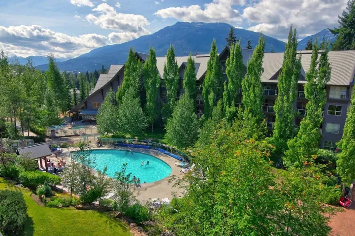 Community pool featuring a patio and a mountain view