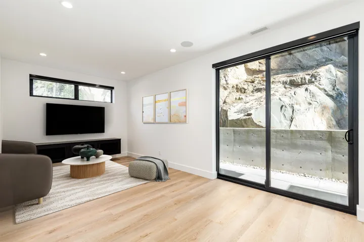 Sitting room with recessed lighting and light wood finished floors