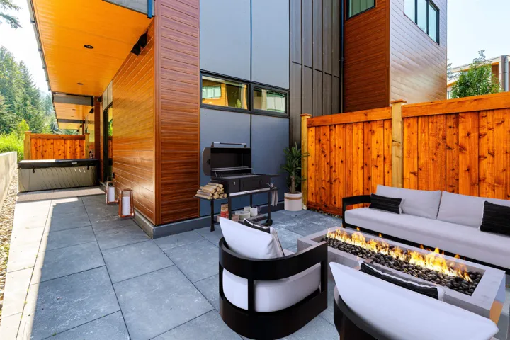 View of patio with an outdoor living space with a fire pit