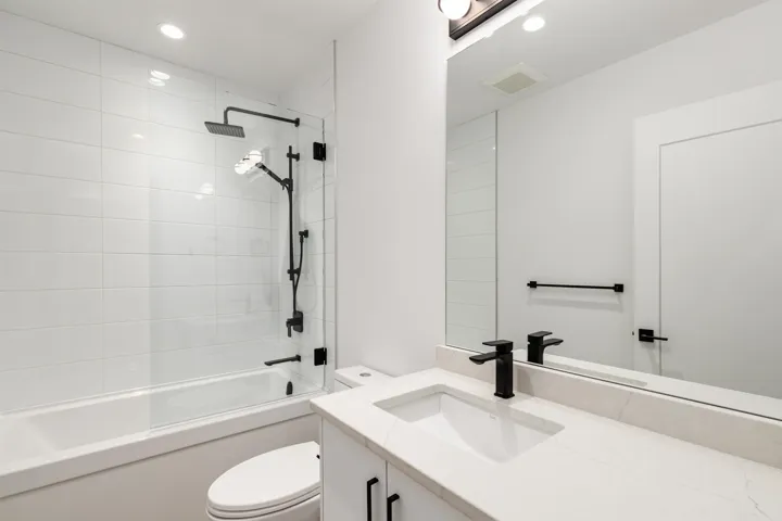 Full bath featuring vanity, shower / bathtub combination, and recessed lighting