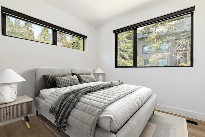 Bedroom featuring wood finished floors and baseboards