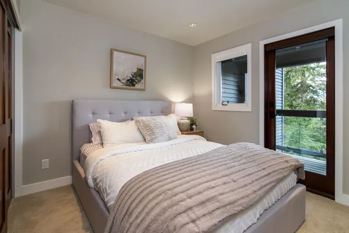 Bedroom with light colored carpet and recessed lighting