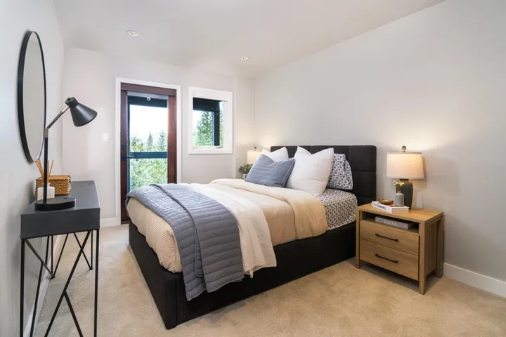 Bedroom with light carpet and recessed lighting