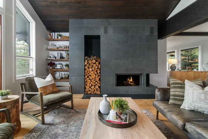 Living room with wood finished floors, a tile fireplace, wooden ceiling, and lofted ceiling