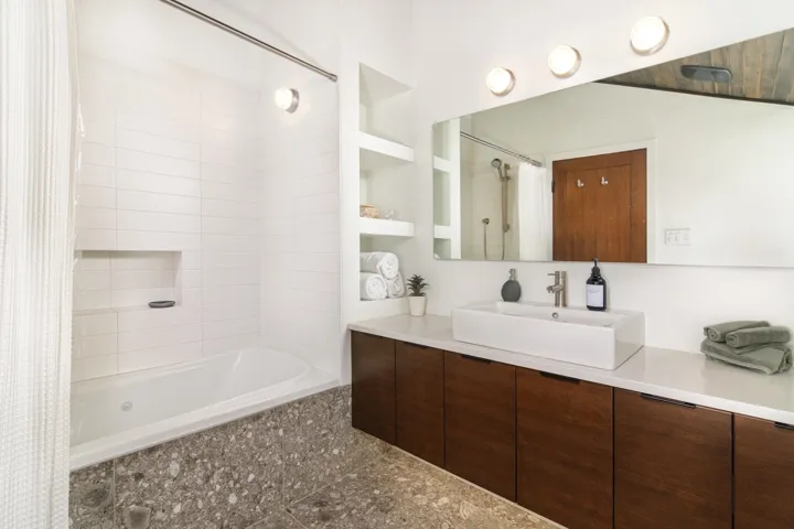 Bathroom with vanity and tiled shower / bath