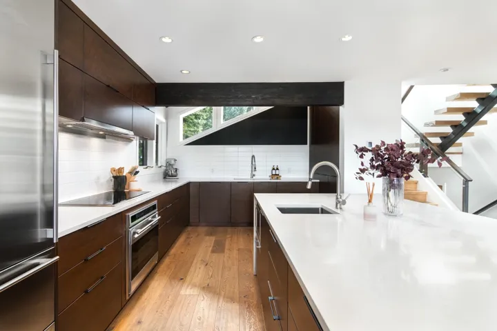 Kitchen featuring appliances with stainless steel finishes, light wood-type flooring, recessed lighting, modern cabinets, and tasteful backsplash