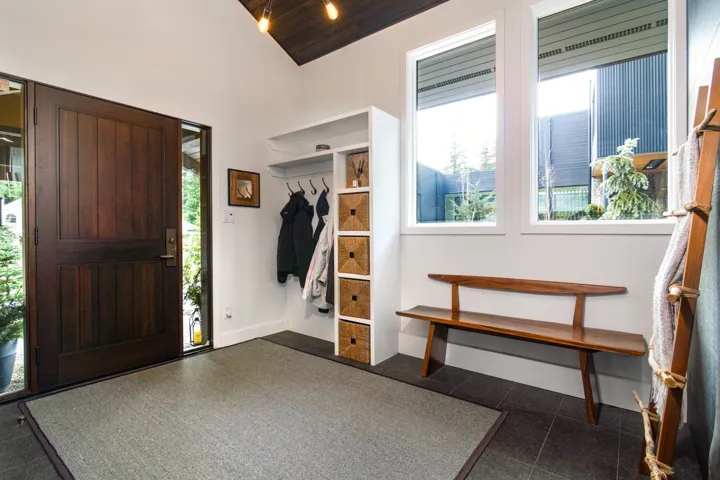 Foyer entrance with wood ceiling and vaulted ceiling