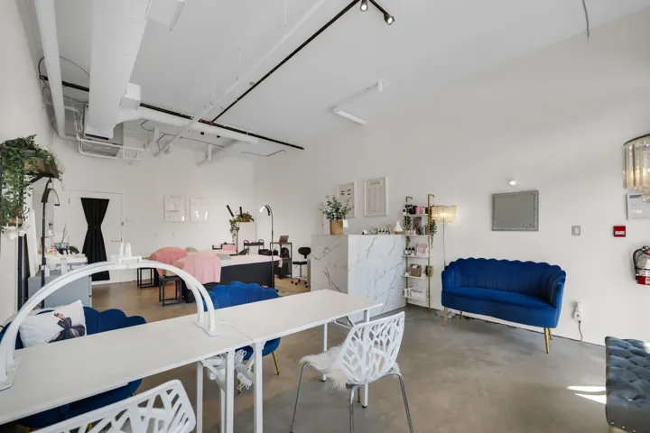 Spacious interior featuring concrete flooring and exposed ductwork