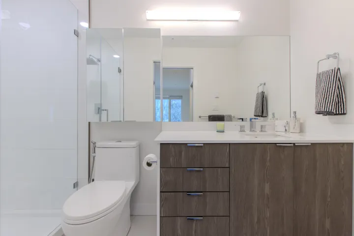 Full bath featuring vanity and a shower stall
