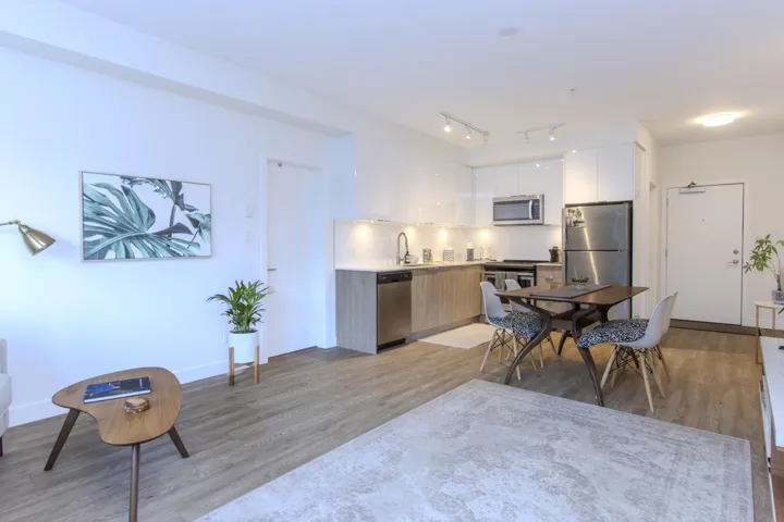 Dining space with light wood-style flooring and baseboards