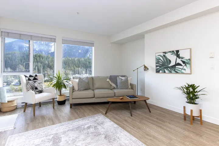 Living room with light wood-style floors and baseboards