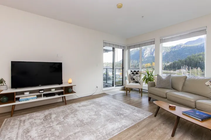 Living area featuring wood finished floors and a mountain view