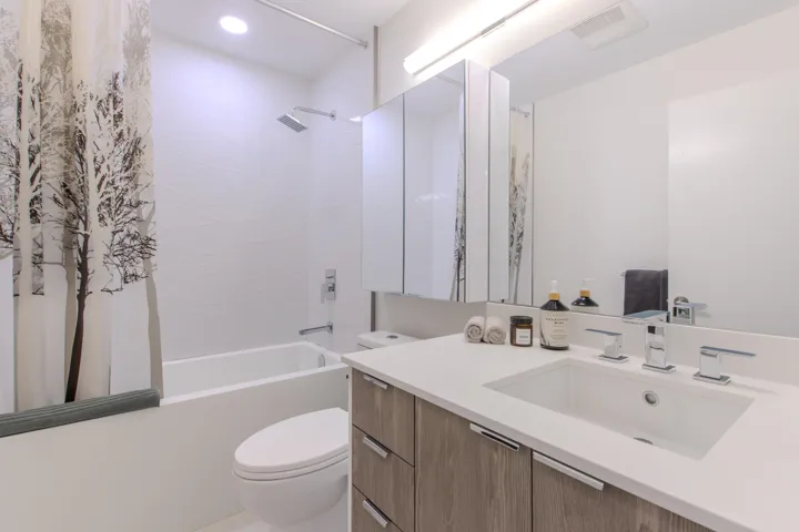 Full bathroom with shower / bathtub combination with curtain and vanity