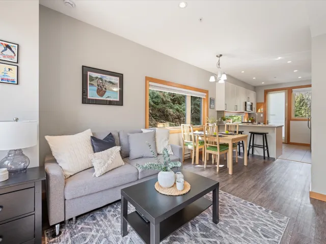 Living room featuring wood finished floors, recessed lighting, plenty of natural light, and a chandelier