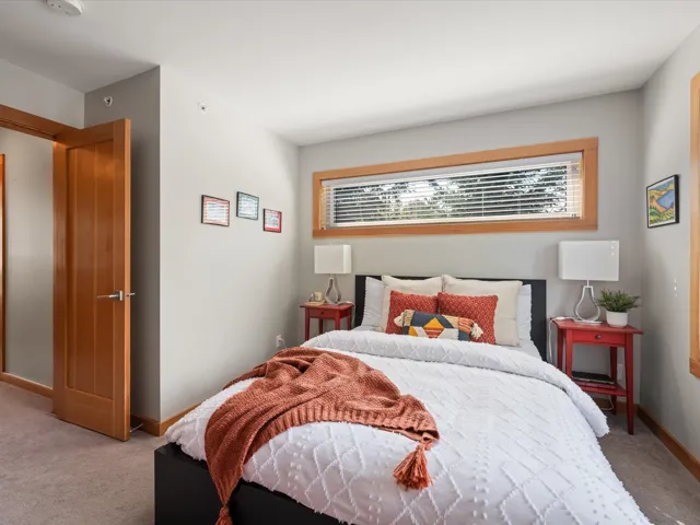 Bedroom featuring carpet floors and baseboards