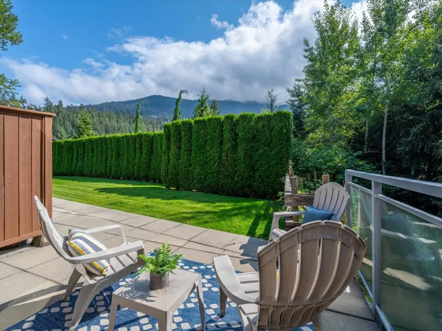View of patio with a mountain view and a forest view