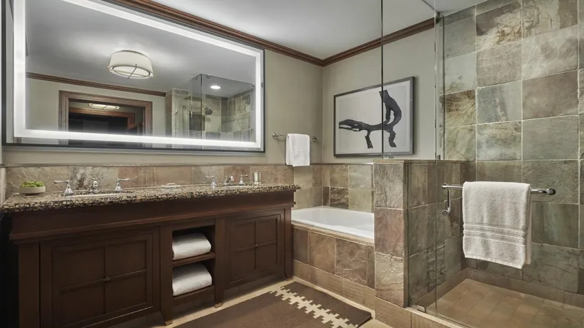 Bathroom with a stall shower, ornamental molding, double vanity, and a bath