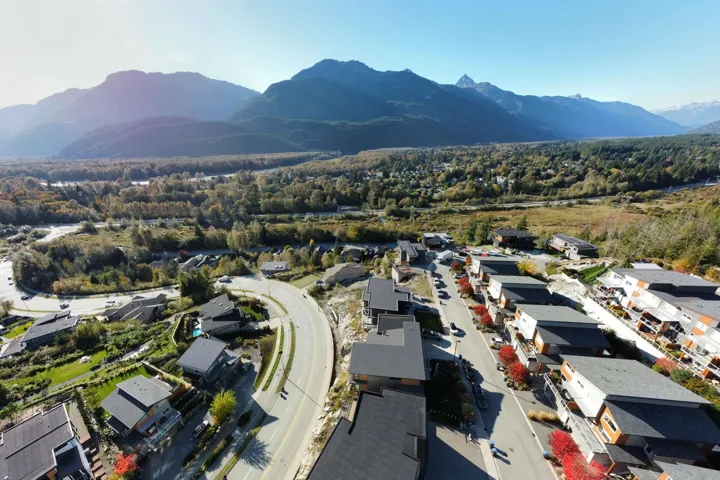 Aerial perspective of suburban area with a mountain backdrop
