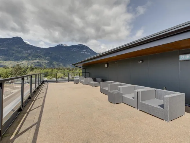 View of patio / terrace with an outdoor living space, a mountain view, and a balcony