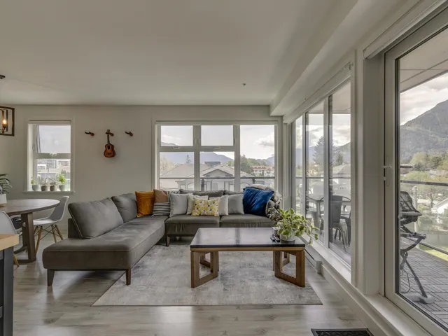 Living room with wood finished floors and a wealth of natural light