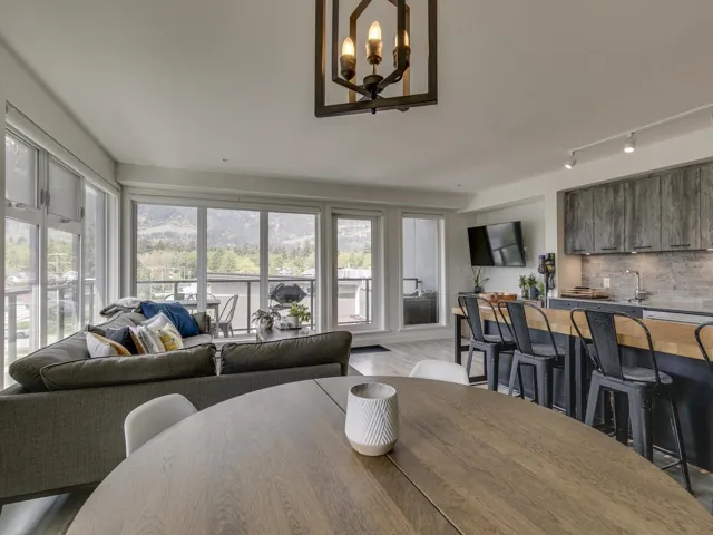 Dining space featuring an inviting chandelier, track lighting, and wood finished floors