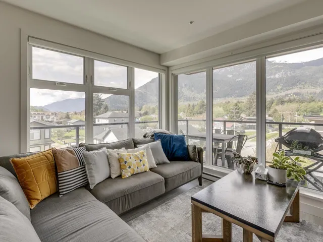 Sunroom / solarium with a healthy amount of sunlight and a mountain view