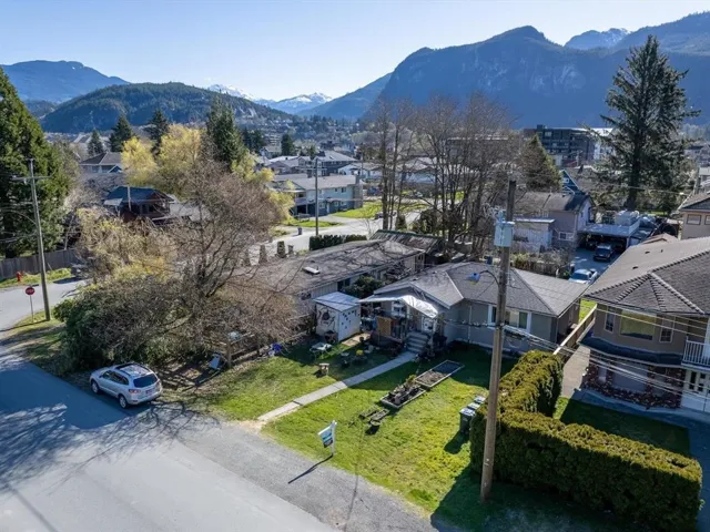 Aerial view of residential area featuring a mountainous background