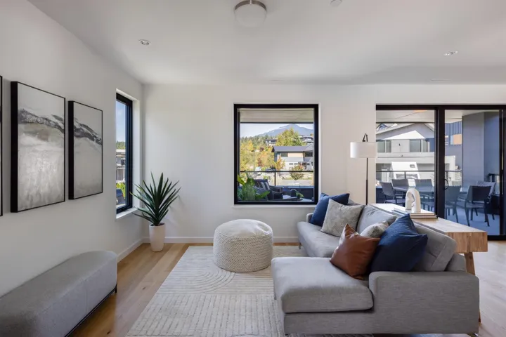 Living room with wood finished floors and baseboards