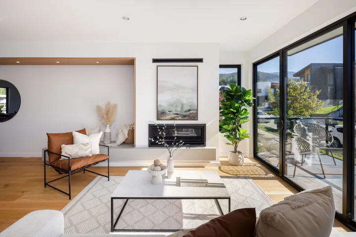 Living area featuring light wood-style flooring and recessed lighting