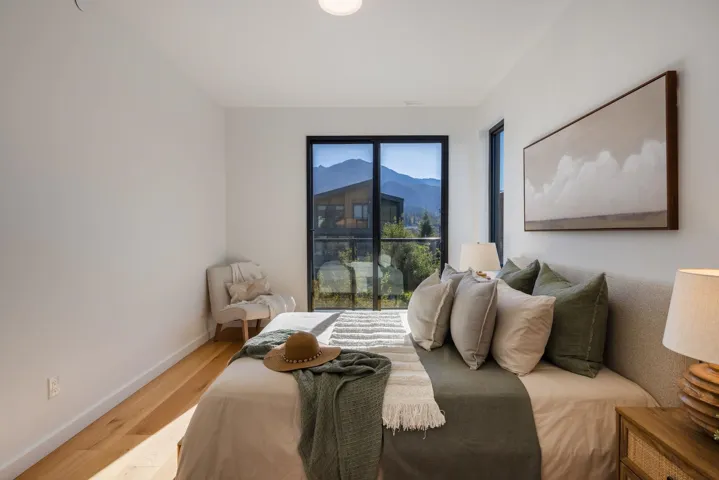 Bedroom with light wood-style floors and baseboards