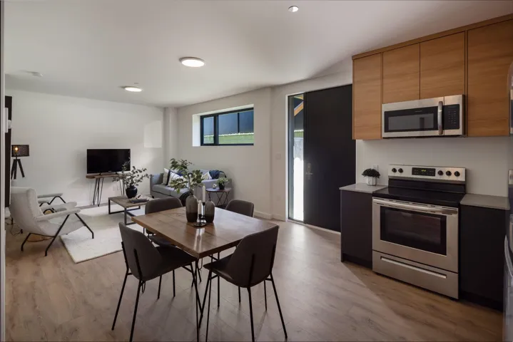 Dining space with light wood-style floors and baseboards
