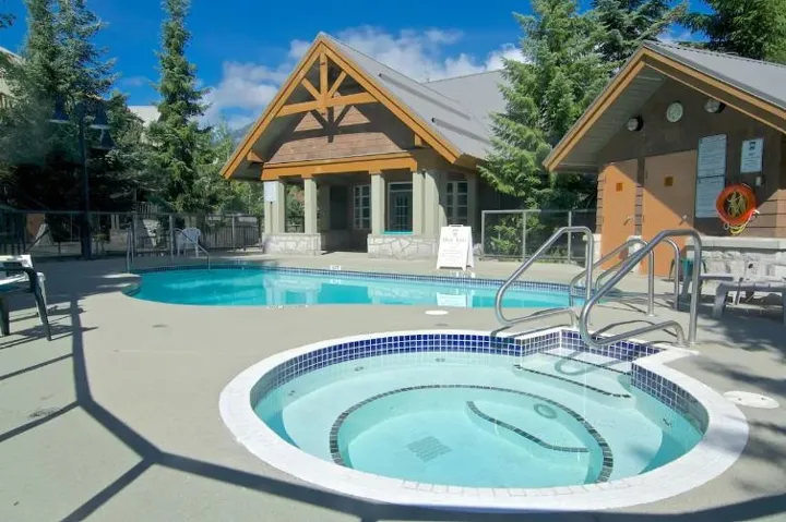 Community pool featuring a patio area and a community hot tub
