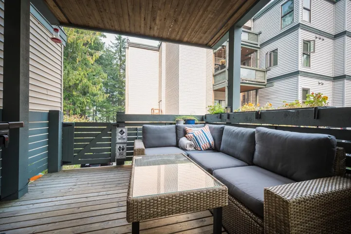Wooden terrace featuring outdoor lounge area
