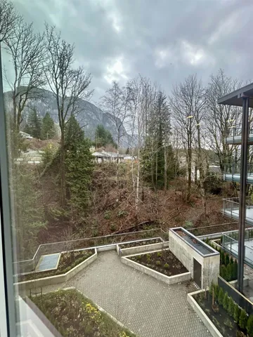 View of yard featuring a vegetable garden, a balcony, and a mountain view