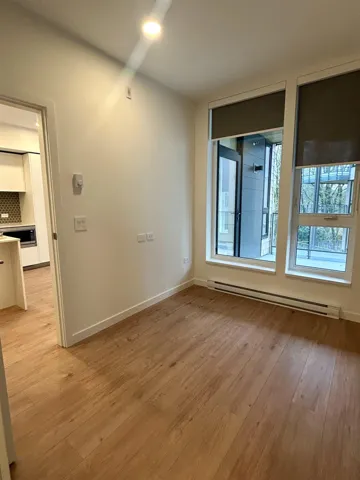 Unfurnished room featuring baseboard heating, light wood finished floors, and recessed lighting