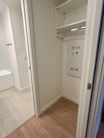 Washroom featuring light wood-style floors and baseboards
