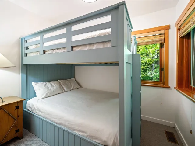 Carpeted bedroom featuring baseboards