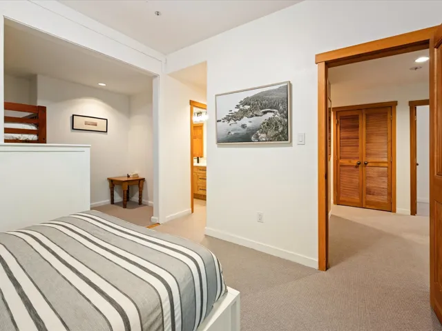 Bedroom with light colored carpet and recessed lighting