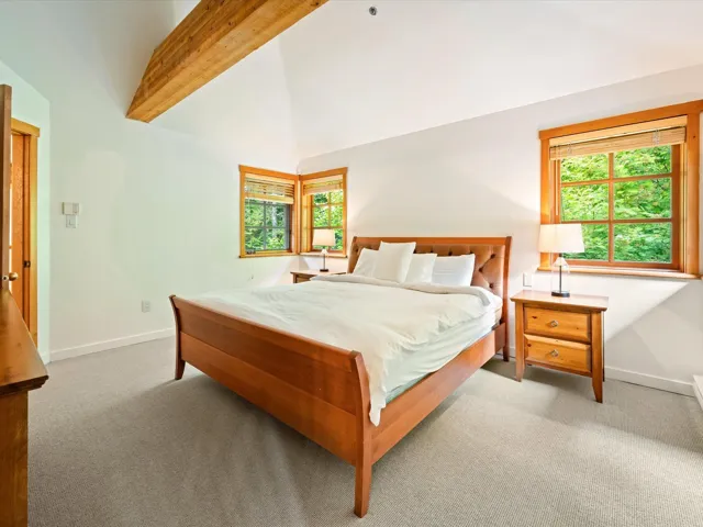 Carpeted bedroom featuring baseboards
