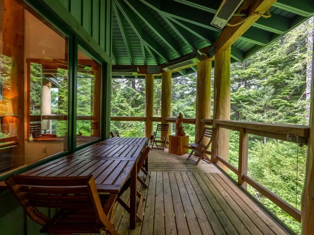 Sunroom / solarium with a wooden deck, hardwood / wood-style floors, and wooden ceiling