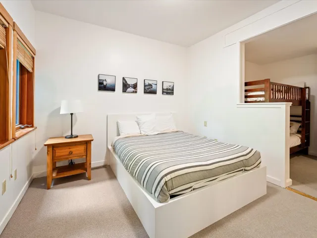 Bedroom with carpet flooring and baseboards