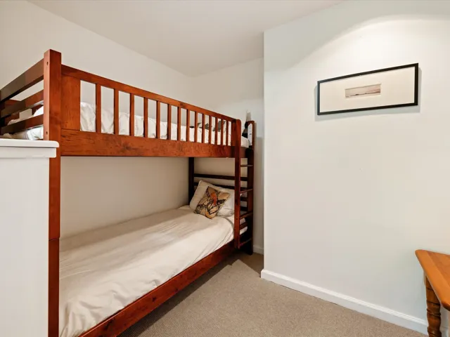 Carpeted bedroom featuring baseboards
