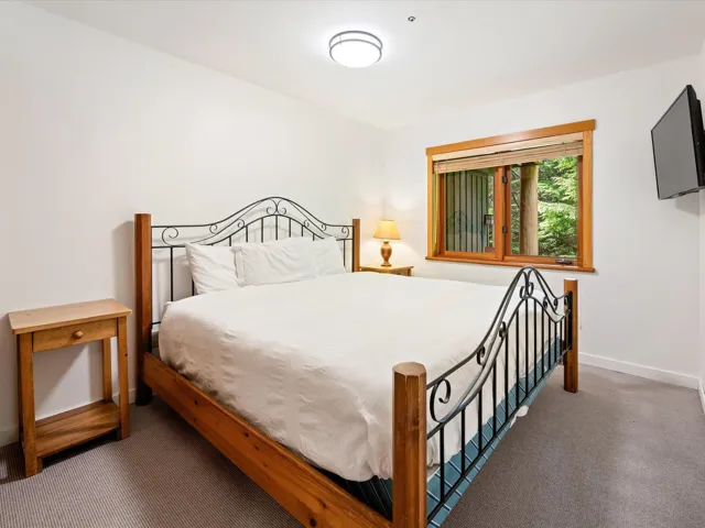 Carpeted bedroom with baseboards