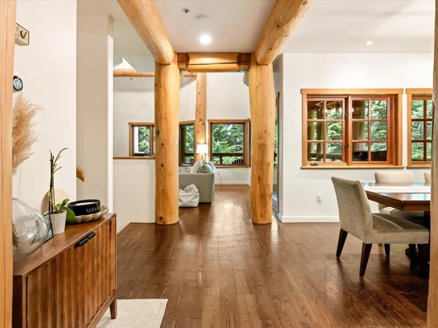 Dining room with beamed ceiling, dark wood finished floors, and recessed lighting