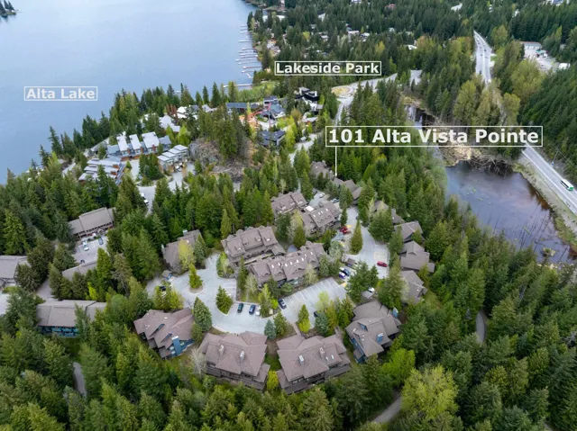 Aerial overview of property's location with a large body of water and nearby suburban area